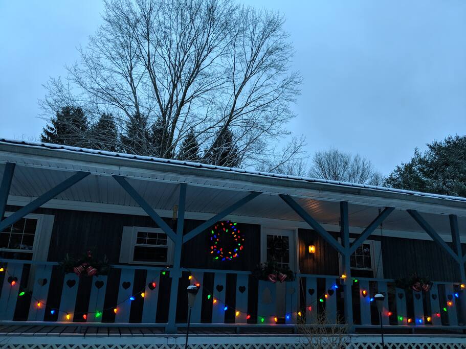 Front porch at Christmastime. Winter bookings and holiday getaways available!