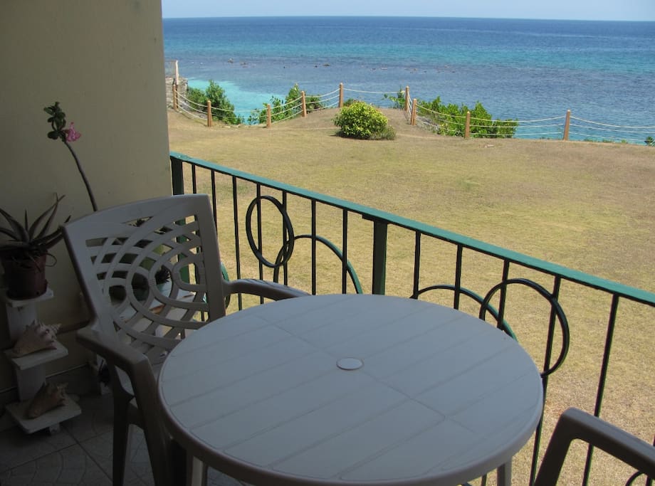 VIEW TO THE POINT WITH SEATING NEAR THE SEA