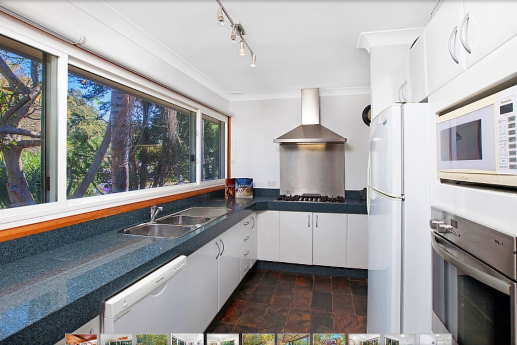 Large kitchen with granite bench tops