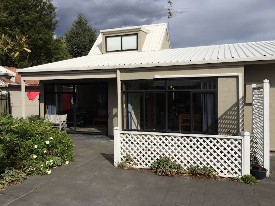 Outside view shows loft window above, lounge is to the left, dinning to the right.