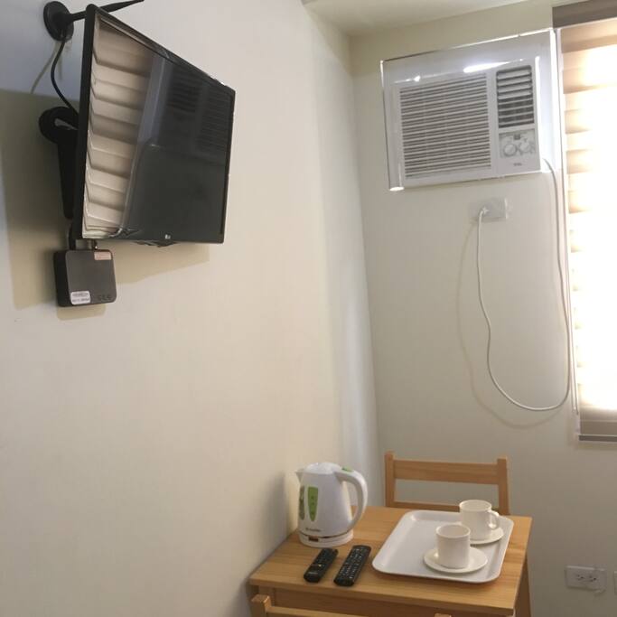 TV with digital local channels, Aircon, Kettle, Cups and working desk to use.