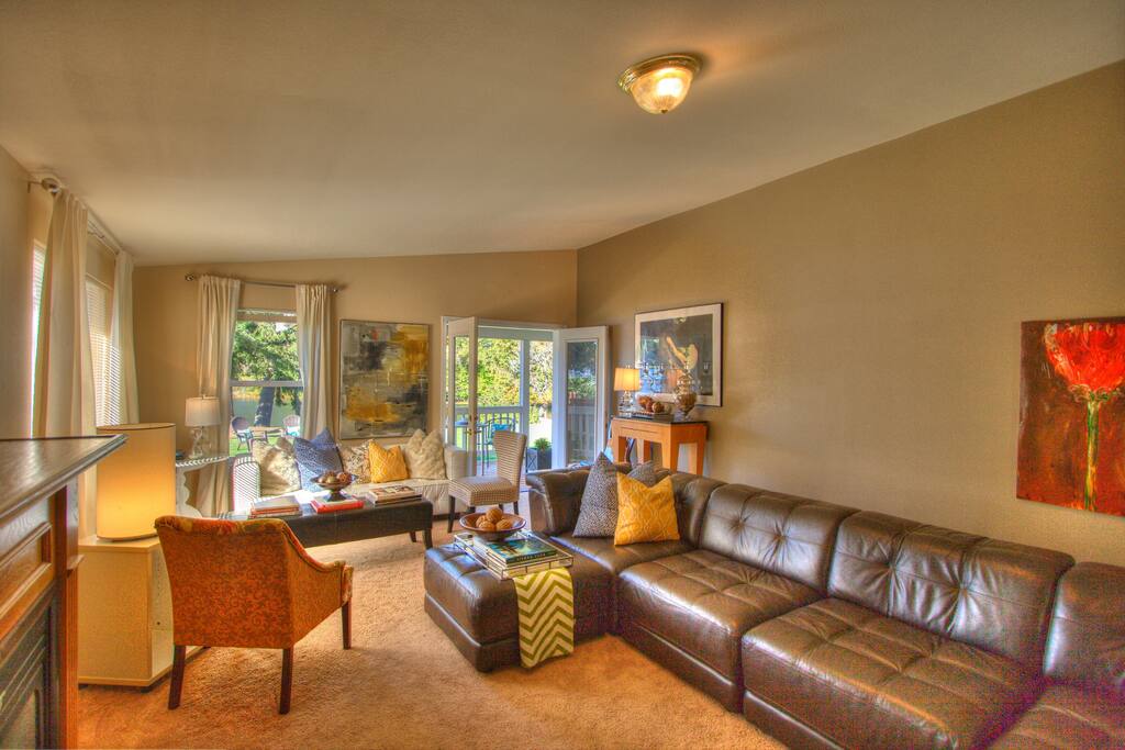 Living room with french doors to garden. Plenty of seating.