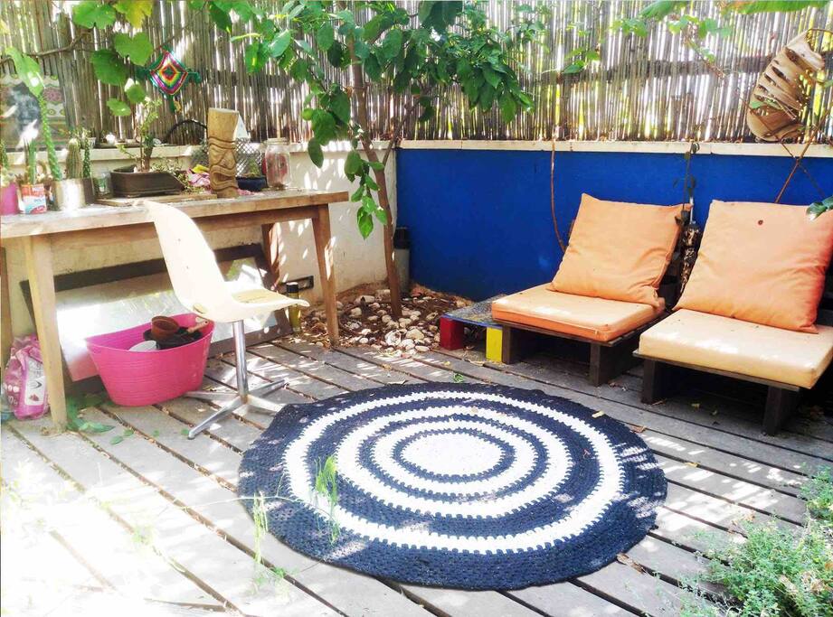 An upper cozy deck in the garden which can also use as an outside office or hosting place. If u have children we bring a plastic pool :))