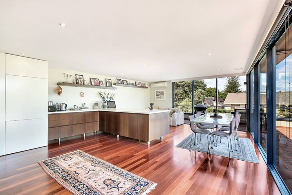 Oversized kitchen with open sitting and breakfast area.