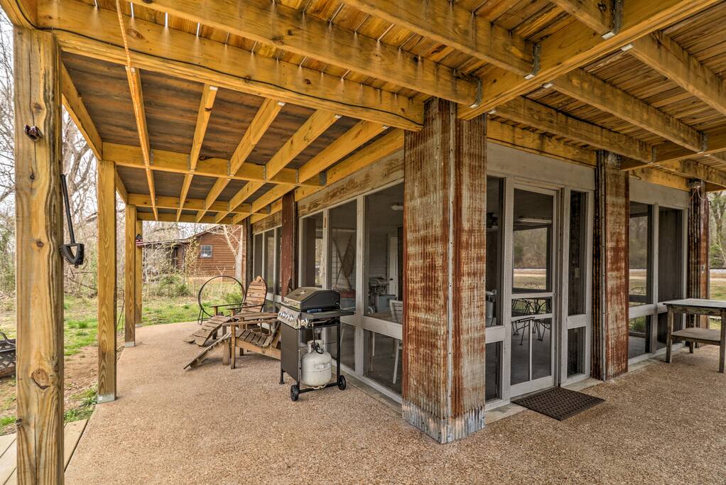 This cabin is an outdoor oasis with shaded patios and second-floor decks.