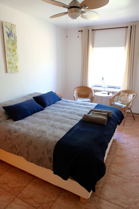 Room 2, King size bed, one window and a small private bathroom