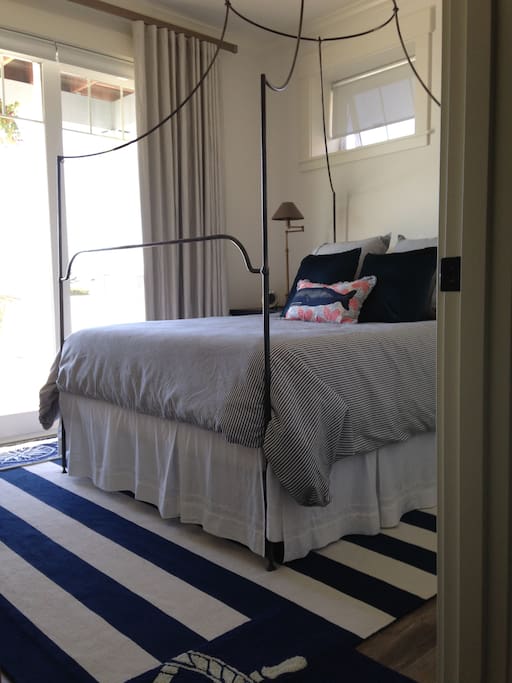 Private bedroom with queen bed and fun nautical decor.