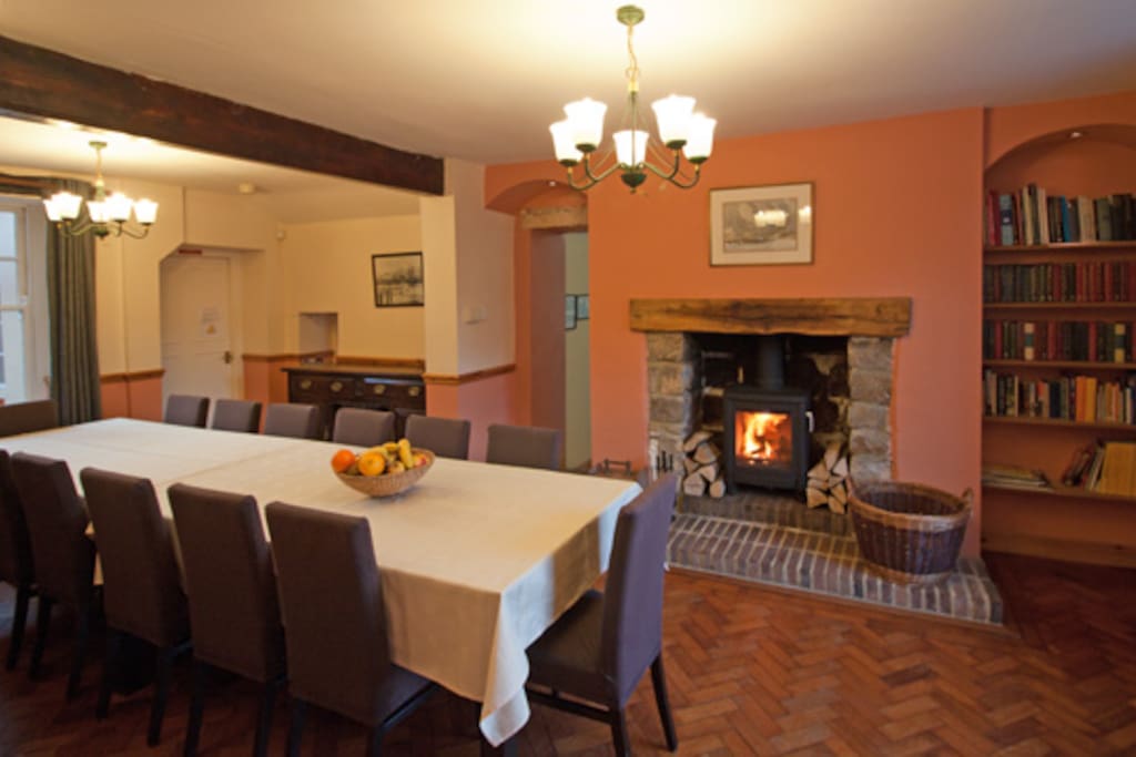 Dining room with wood-burning stove and seating for 14.