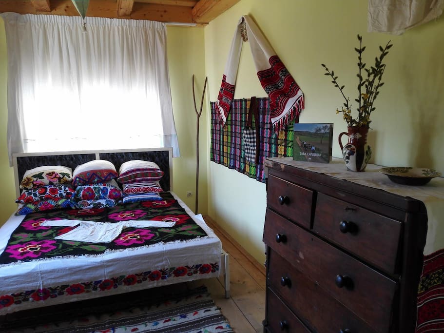 Double room in modern house Casa Carolina in the sleepy village of Cupseni, Țara Lapusului. The property spread over one hectare of land with views to Șatra and Gutai mountains has traditional Maramures houses around.