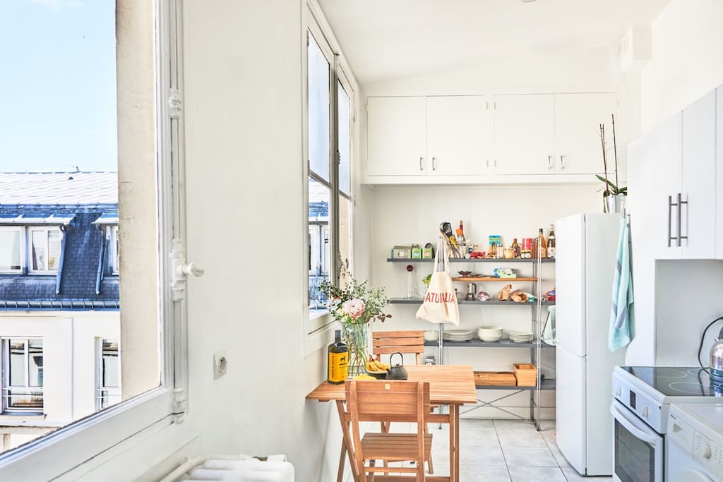 Kitchen with electric stove/oven, washer, big fridge etc.
