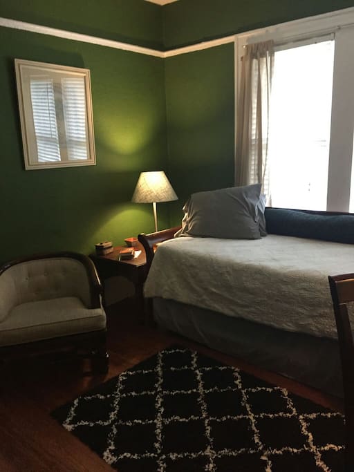 The room has both overhead lighting and lamps.