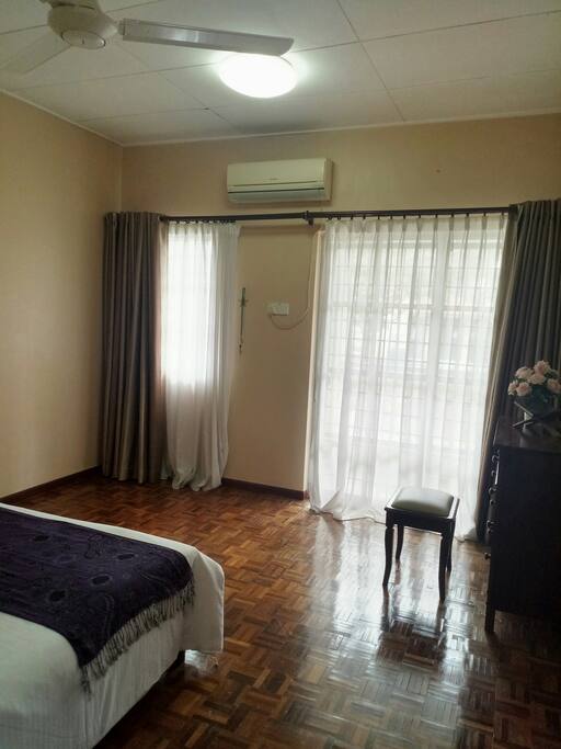Master bedroom . Complete with air conditioner, dresser, wardrobe and attached bathroom.