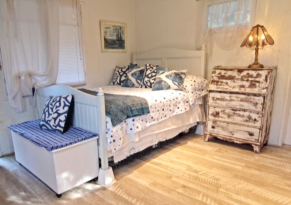 Real size, bright, antique desk/chest of drawer, trunk with extra blankets and storage.