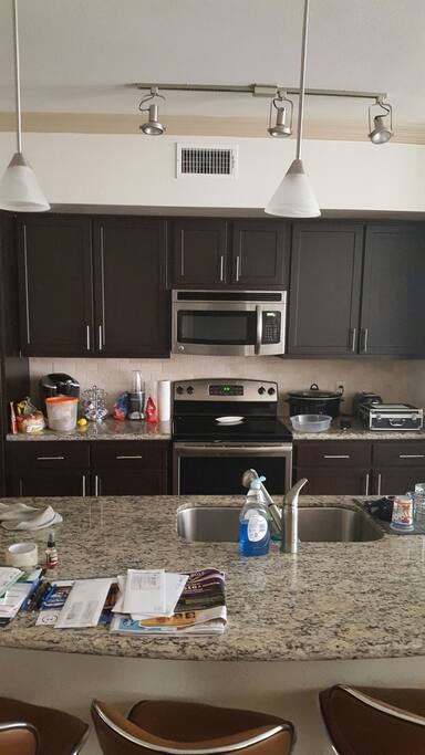 Gorgeous kitchen, granite counter tops; breakfast bar perfect for eatimg/drinking