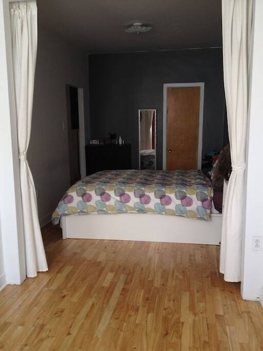 View from the office area into the bedroom (large double room).
