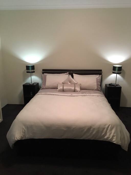Main bedroom. Queen pillow top mattress with its own bathroom and walk in robe and wall mounted television.