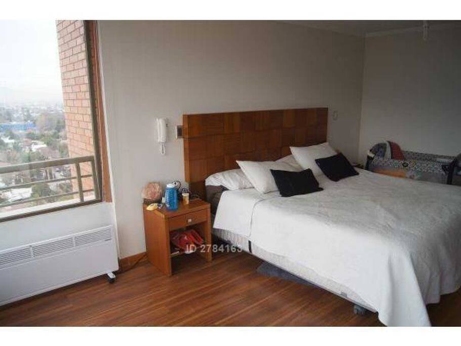 Main Room. King Size Bed and a Pack n' Play Crib