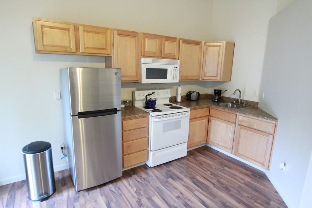 Brand new fridge, microwave, electric range, toaster, coffee maker