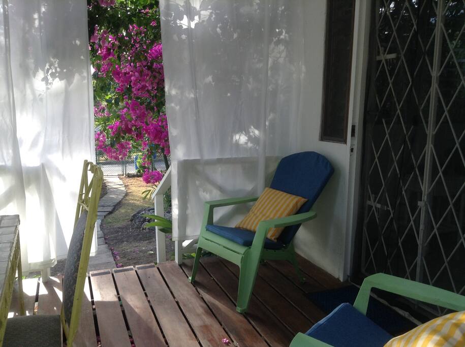 Verandah area with white curtins around.