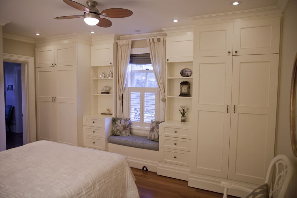 Window seat, closets and drawers.