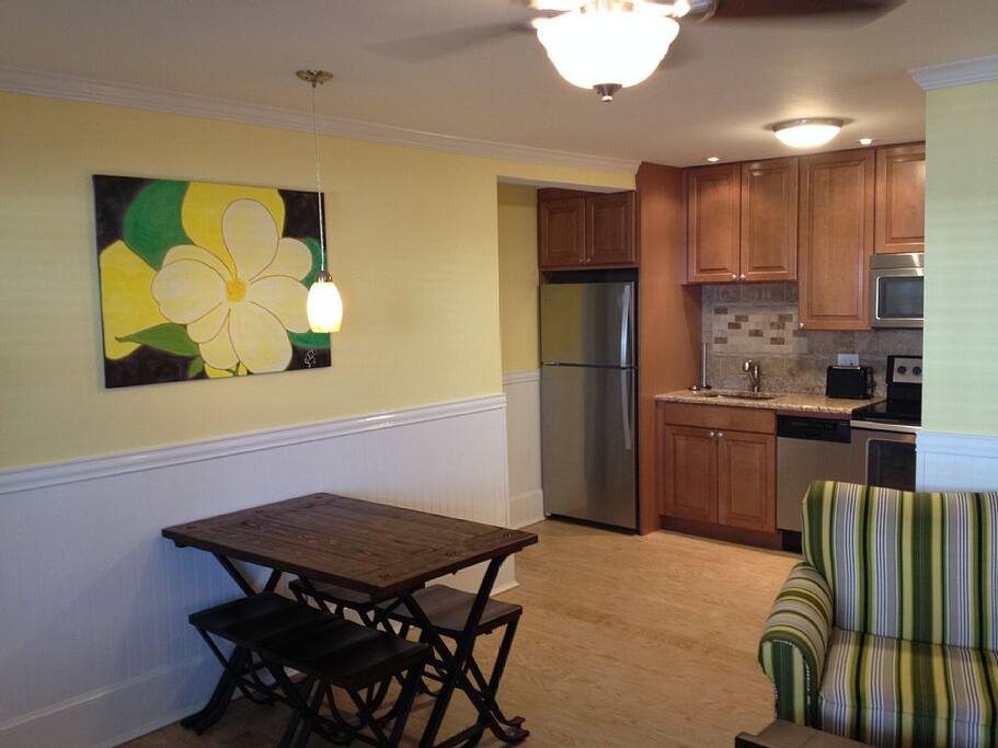 View Of Dining Table Towards Kitchen