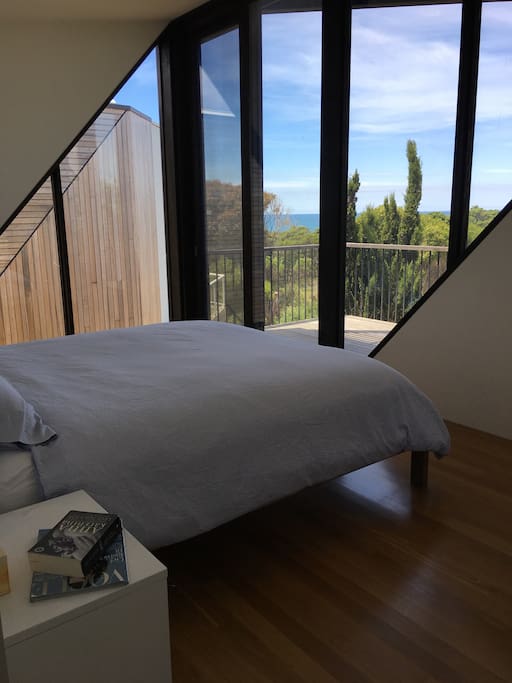 If you're in charge of this booking, you get THIS room! :) Master with KB and ensuite bathroom and walk-in robe; balcony and sliding door with fly screen that can be left open at night to hear the ocean roar...