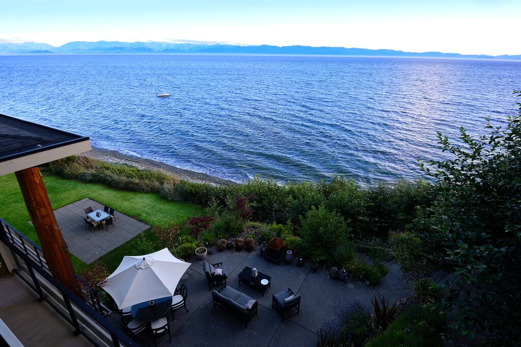 Panoramic ocean and mountain views from a large private deck