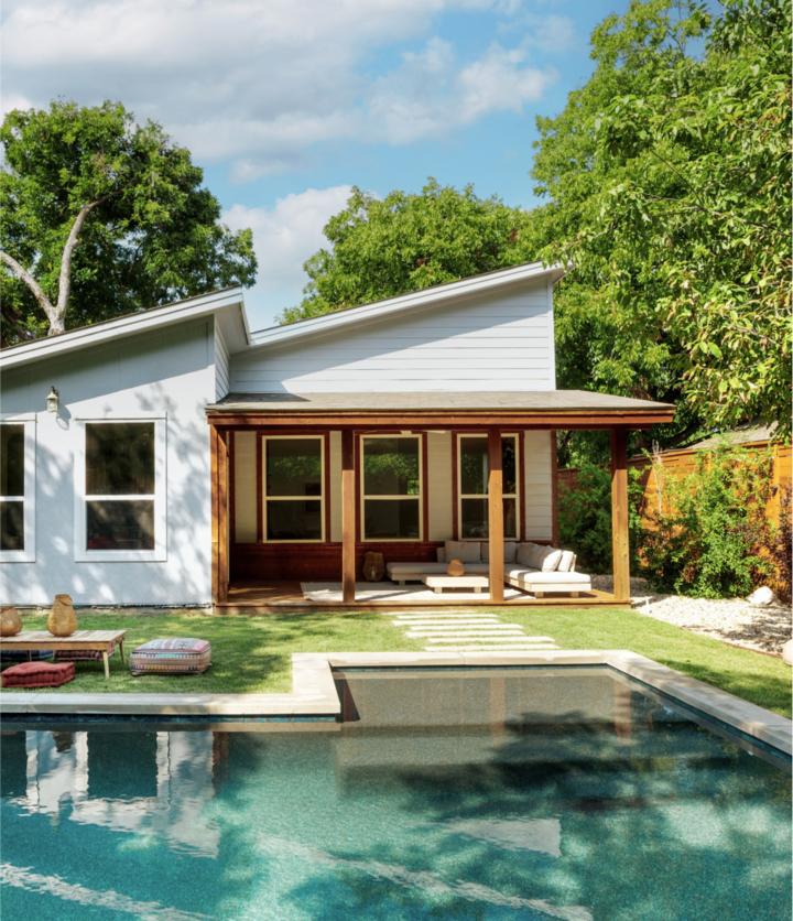 A poolside escape under the hot Austin, Texas sun. A modern backyard patio with caramel brown beams supporting a shaded area for ample rest and relaxation.