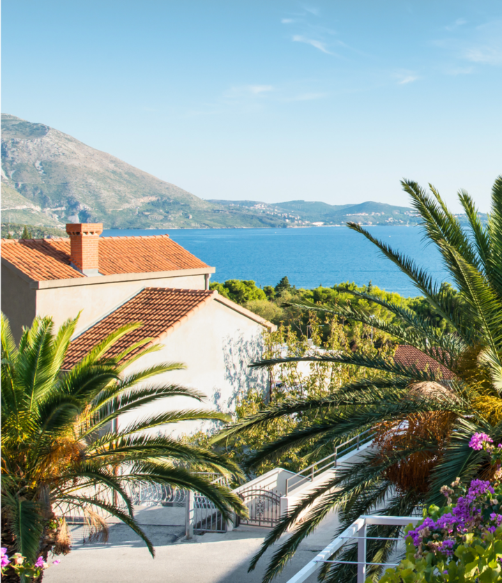 A garden veranda overlooking vast stretches of terracotta roofs in the city of Dubrovnik. Complete with a cool pool and lounge furniture, this getaway easily sports one of the best views in the city—with both style and comfort included.