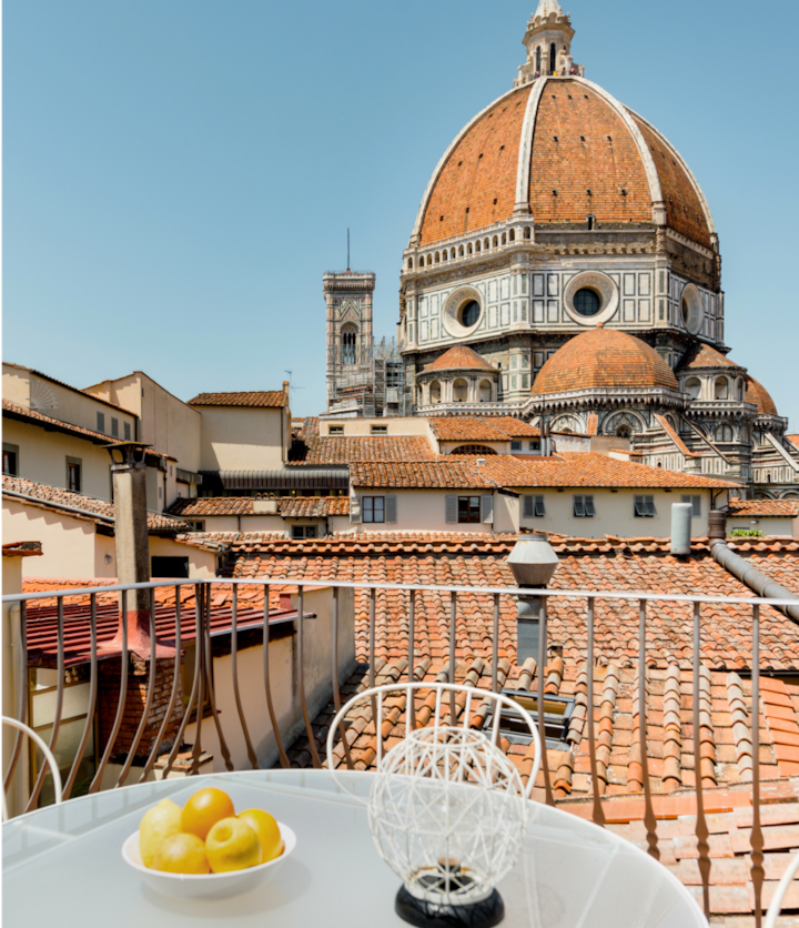 An historic apartment in the heart of the city of Florence. From the outdoor veranda, the terracotta hue of the city’s rooftops contrast the blue sky of this old-world Italian town.