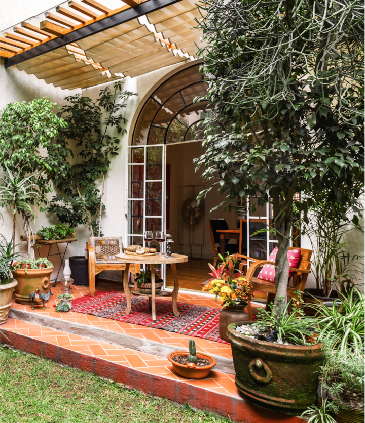 A 1920s home in the La Condesa neighborhood. Patio doors lead out to a colorfully stunning backyard escape in the heart of the city.