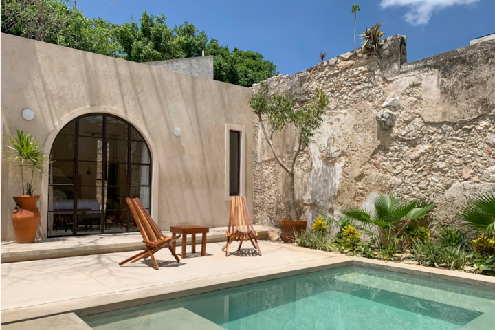 Almost Mediterranean in stylings, this yellow, old-world, colonial-style getaway is both spacious and inviting. Giving off the feeling of both security and privacy, the waiting pool below the shade of the upper floor offers comfort, as well.