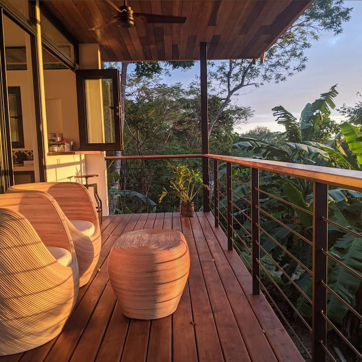 An open-air balcony provides the perfect sunset view. 