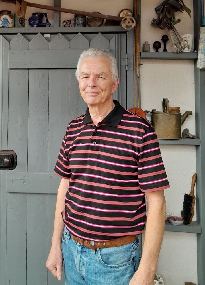Photo of Allan, experienced Co-Host in Oakleigh East, Australia, standing in front of a home's door, smiling at the camera.