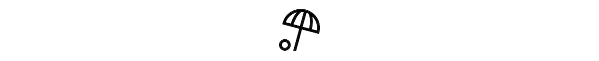 An icon representing Airbnb beach homes. The icon shows a black and white illustration of a beach umbrella next to a beach ball.