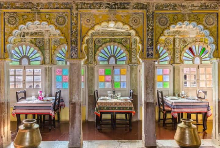 Rich, colourful interior of a restaurant with sun coming through