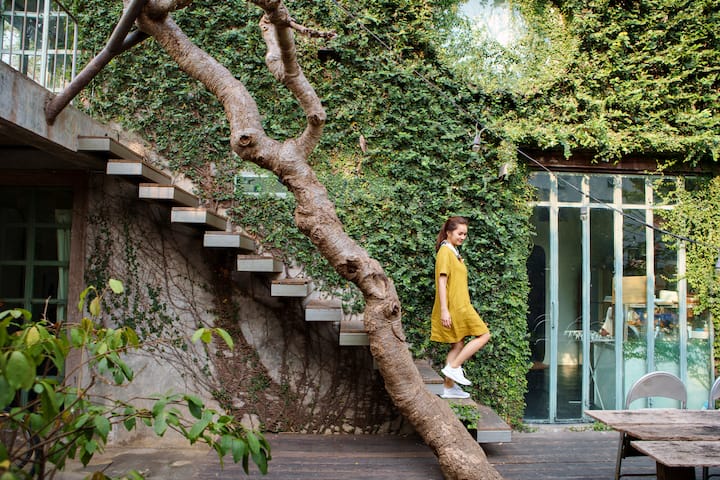 Woman climbs down stairs in beautiful outdoor location