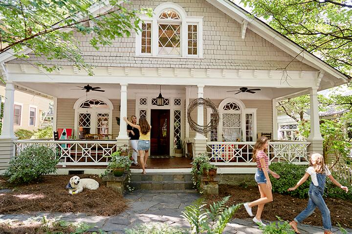 Guests playing on the porch of their listing