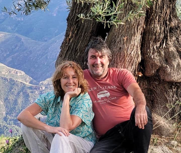 Oliver and Maria, two Airbnb Hosts of a listing located in an area surrounded by Olive Groves.