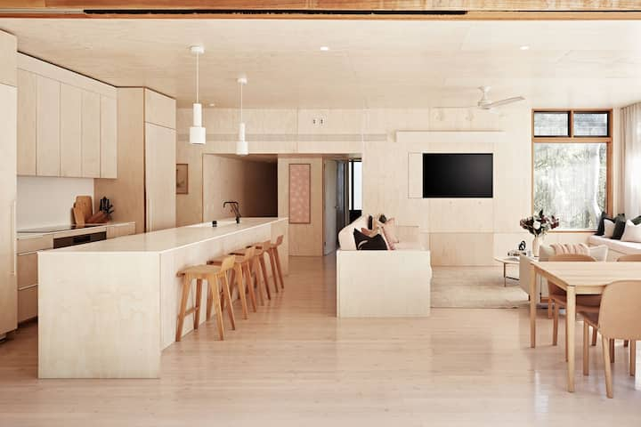 Beautiful kitchen in shades of brown and marble with designer furniture