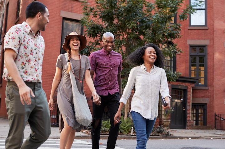 Four young people smiling 