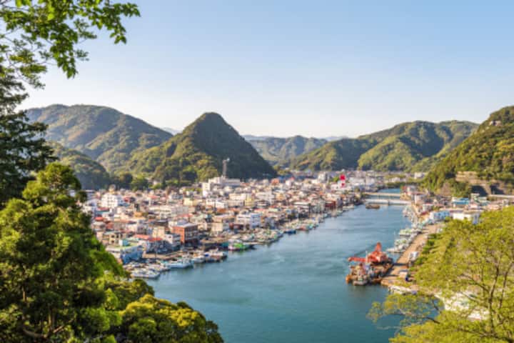Image of a waterfront filled with fishing boats in Izu.