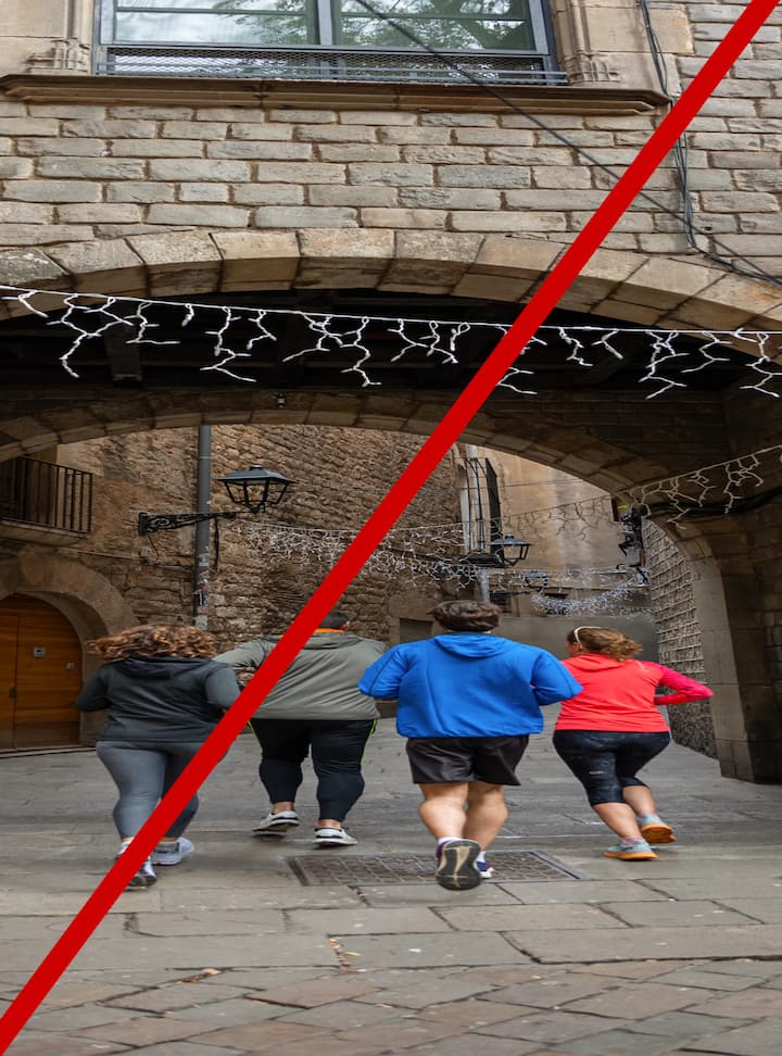 Four people jogging through a historic stone alleyway decorated with string lights, divided by a diagonal red line indicating the image would be rejected due to distortion.