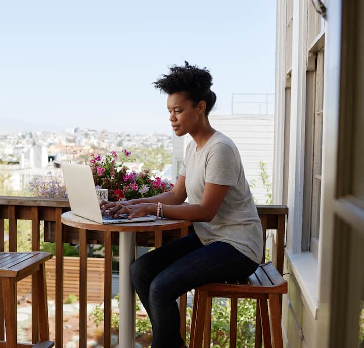 Woman works on her computer 