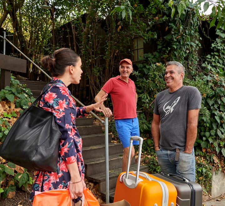 Guests arrive with suitcases