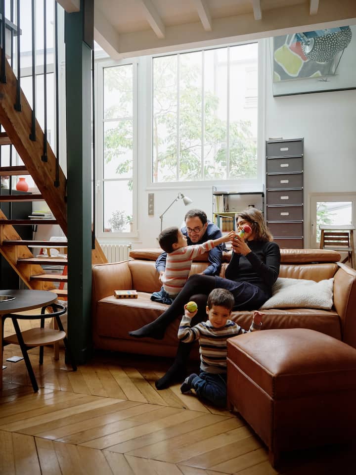A family enjoying quality time in an Airbnb apartment