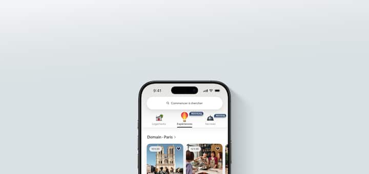 La nouvelle appli Airbnb montre trois nouveaux onglets pour les logements, les expériences et les services. Les expériences sont mises en évidence.