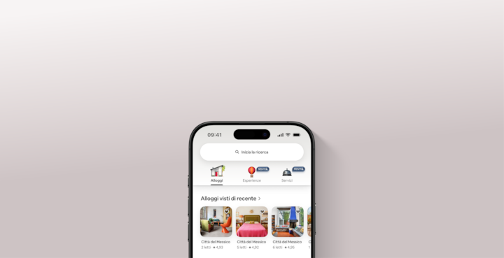 Una schermata della nuova versione dell'app di Airbnb mostra tre schede: Alloggi, Esperienze e Servizi.