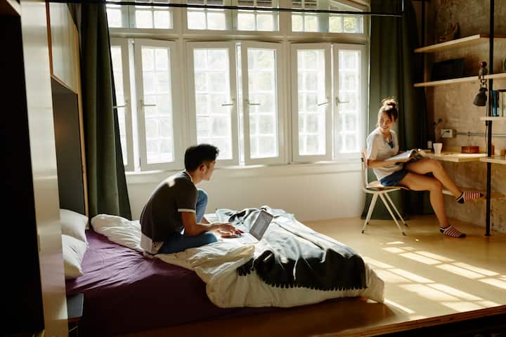 a man and a woman are having a conversation in a listing