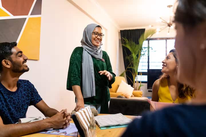 A Malay lady talking to her friends
